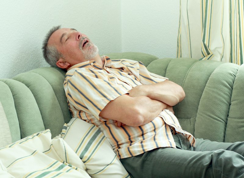 man sleeping on a couch